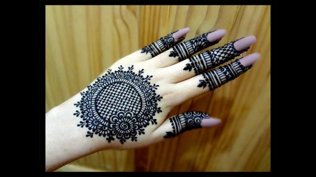 Close Up Of A Person's Hand With A Henna Tattoo - Free Mehndi Design Photo